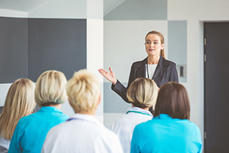 Woman safety professional briefing staff