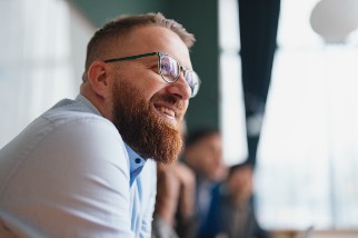 Closeup of a smiling safety professional man with a beard