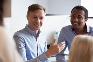 Group of office colleagues engaged in conversation