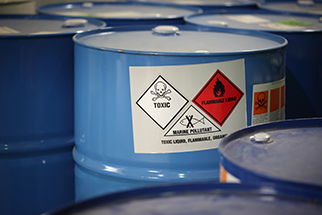 Chemical barrels with GHS labels in factory